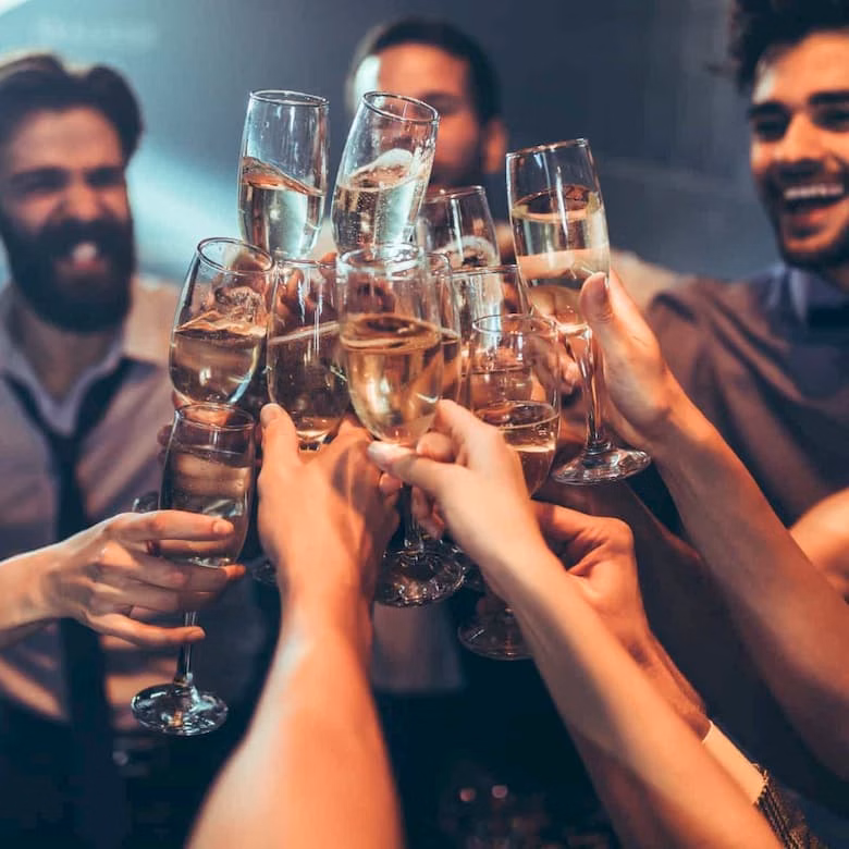 People drinking champagne at party